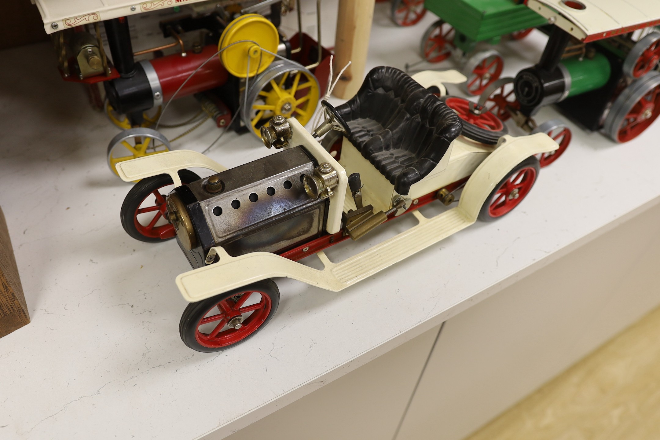 A boxed Mamod Showman's Engine and Lumbar wagon, and unboxed Steam Tractor and roadster- roadster 39 cms wide.